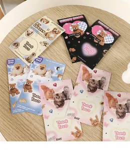 Detail of Y2K aesthetic stationery stickers featuring cats, dogs, and teddy bear motifs