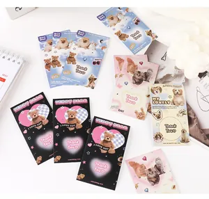 Detail view of American Y2K aesthetic pet cards featuring teddy bears and puppy motifs