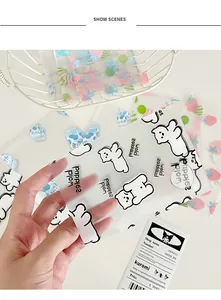 Detailed view of translucent frosted card packaging bags with cute cartoon bear prints