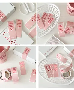Close-up of pink 'This package is happy to see you too' adhesive sealing stickers