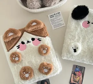 Detail of plush animal-shaped tablet sleeve with soft faux rabbit fur and cute embroidery