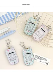 Macro shot of phone-shaped acrylic card holders with cute Y2K motifs and star-shaped hooks