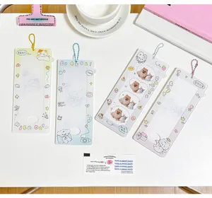 Detail of four cute cartoon acrylic photocard holders with colorful bead chains
