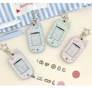 Macro view of retro flip phone acrylic keychains in pastel colors with star hooks