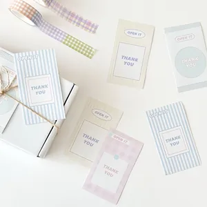 Minimalist pastel receipt stickers with Open It and Thank You text for gift packaging