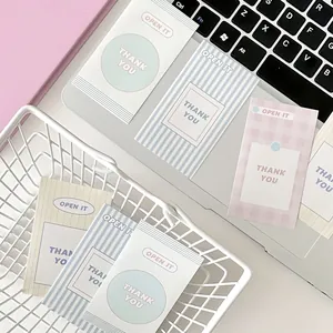 Flat lay of colorful minimalist Thank You sealing stickers for gift packaging aesthetics