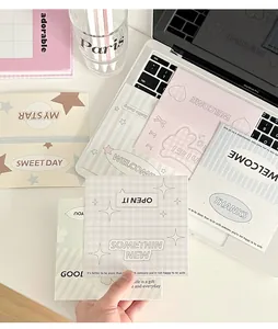 Detail of minimalist Korean style stationery card sets on a desk with macaron patterns