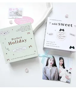 Close-up of pastel plaid photo albums with ballet bow design and magnetic closure