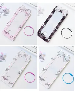 Detail of colorful acrylic card holders with ribbon bows and spiral steel rings