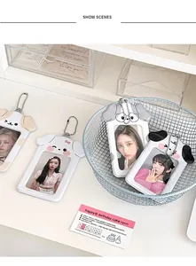 Detail showing four cute puppy-shaped PVC photo card holders with metal ball chains
