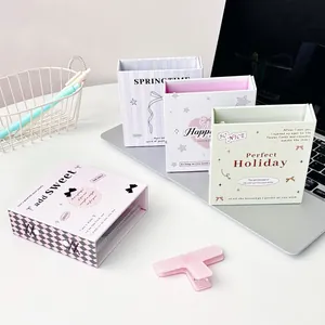 Mini photo album set in pastel colors with bow designs and magnetic closure for polaroids