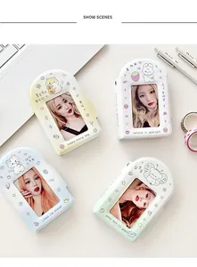 Four colorful mini photo albums with cute cartoon animals and clear cover windows