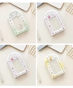 Close-up of cute cartoon photocard holders in pastel pink, yellow, and green colors