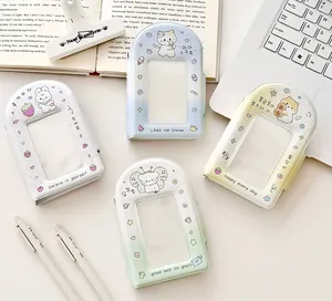 Flat lay of four colorful cartoon PVC photo card holders with cute animal illustrations