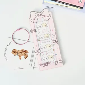 Pink striped acrylic photo card holder with large bow and four heart-shaped puppy windows
