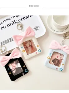 Detailed plush photo card holders in black, white and blue with pink bow and star embroidery