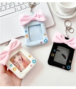 Detailed plush ribbon photocard holders in white, light blue, and black with keychains