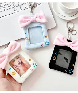 Macro detail of plush photocard holders with pink bows and colorful star embroidery