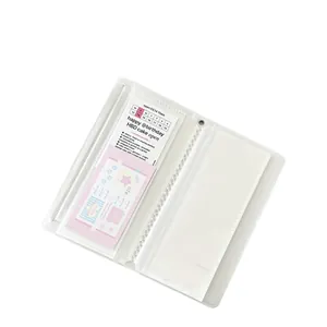 White ballet style photocard album with bow design and transparent sleeves in 45-degree view