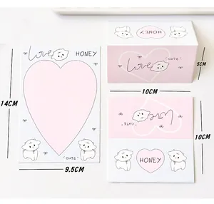 Vista detallada de papelería de corazón rosa con motivos de cachorros y medidas del producto