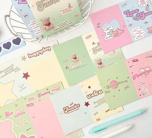 Detail of Y2K aesthetic bifold cards with plush bear motifs and star patterns