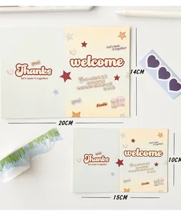 Macro shot of Y2K style folding greeting cards with artistic font and star patterns