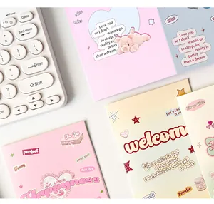 Macro view of cute Y2K stationery card set with teddy bear and lace heart patterns
