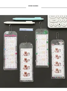 Detailed view of transparent glitter PVC photocard holders with cute cartoon four-leaf clover