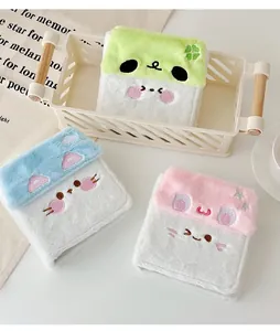 Detailed plush card holders in green, blue and pink with cute embroidered faces