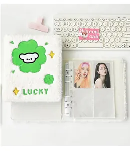 Detailed view of white plush A6 photo album featuring clover embroidery and 6-ring binder