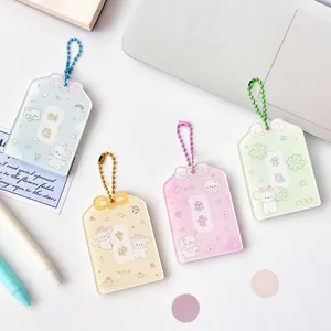 Four colorful cartoon puppy protective card sleeves with metal chains and charms