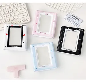 Flat lay of colorful 3-inch mini photo albums for polaroid storage in pastel colors