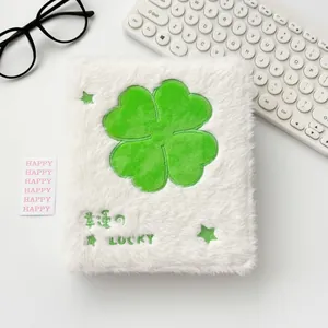 Plush white A6 binder with lucky clover embroidery and soft fluffy texture cover