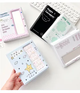 Detail of colorful cartoon photo albums with transparent cover windows and cute cat prints
