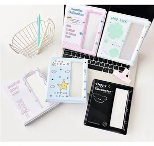 Mini photo albums in five pastel colors with cute prints on a white laptop