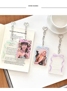 Detailed view of four colorful acrylic photo card holders with metal heart chains and bows