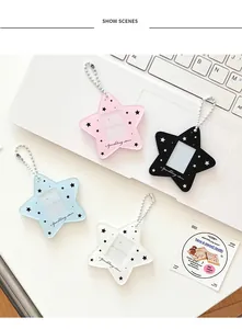 Star-shaped acrylic photo card holders in four colors displayed on a desk
