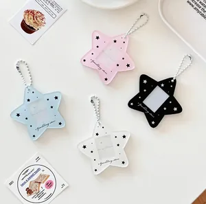 Detail of star-shaped acrylic photo card holders with metal chains in four colors