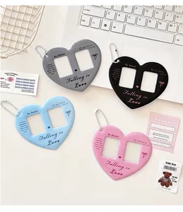 Double heart acrylic photo holder keychains in grey, black, blue, and pink colors