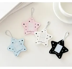 Close-up of star-shaped acrylic card holders with colorful bases and bead chains
