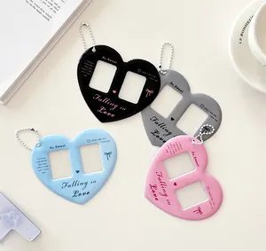 Flat lay of double-slot heart-shaped acrylic photo card holders with colorful bead chains