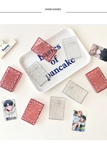 Detail of glitter photocard holders with star patterns and The First Snow text