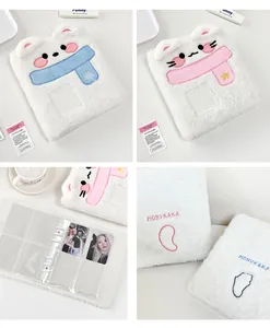 Detail of plush animal photo card binder with stainless steel rings and clear PVC sleeves