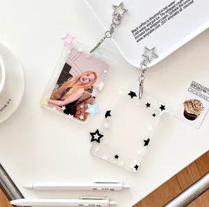 Detailed view of clear star-patterned acrylic photocard holders with star keychains