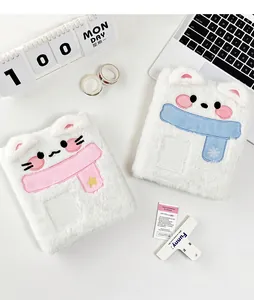 Detail of plush laptop sleeves with cute puppy and kitten embroidery and 3D scarf design