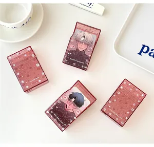 Detail of glitter photocard holders with star patterns and anime illustration cards