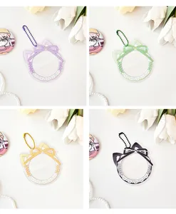 Detail of cat-ear lace acrylic badge holders in purple, green, yellow and black colors