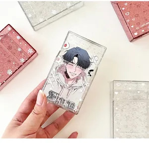 Detail of glitter photocard holders with star patterns and flip-top closure design