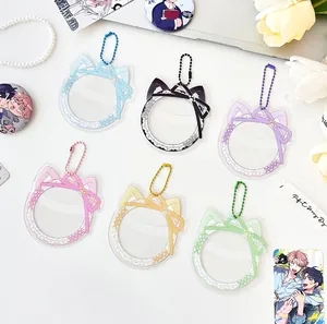 Detail of cat ear acrylic badge covers with lace patterns and matching silk bows