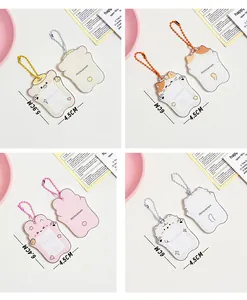 Detail view of 1-inch acrylic card holders with cute cartoon animals and metal bead chains